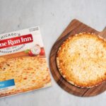 Home Run Inn frozen pizza on a peel