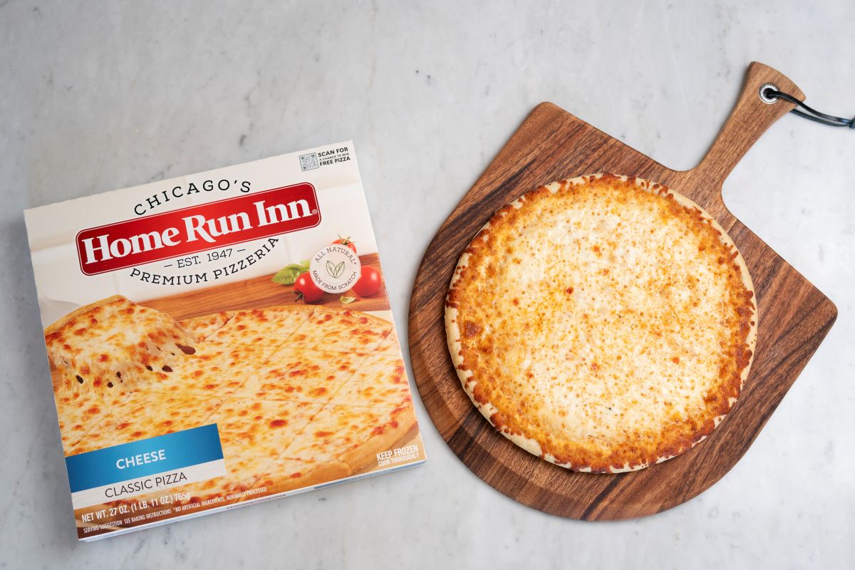 Home Run Inn frozen pizza on a peel