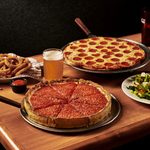 Beggars Pizza retro photo of food spread