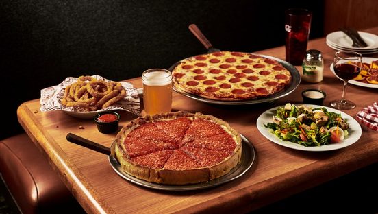 Beggars Pizza retro photo of food spread