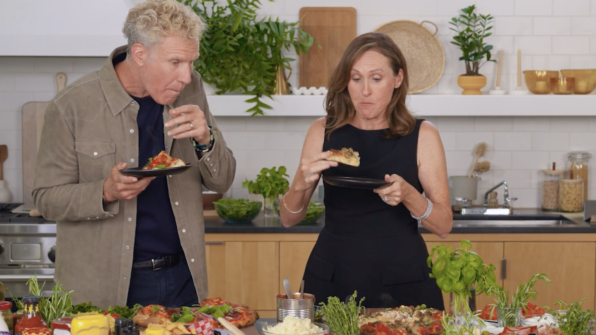 This photo shows Will Ferrell and Molly Shannon eating pizza in the New York Times' studio kitchen.