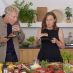 This photo shows Will Ferrell and Molly Shannon eating pizza in the New York Times' studio kitchen.