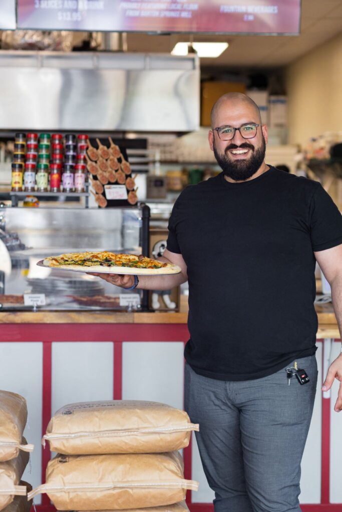Darius T. Aram, owner and founder of Slice Street Pizza in Dripping Springs, Texas, and GLD Hospitality, LLC